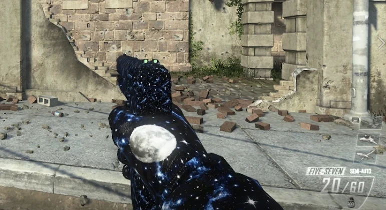 A Five-seven pistol in game covered in a starfield pattern, with a moon on the grip
